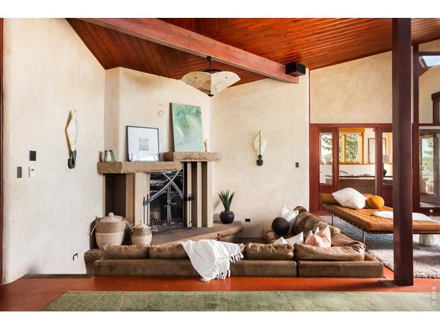 Property Photo 18 Sunken Frank Lloyd Wright Rumford fireplace with custom built-in leather couch. 
