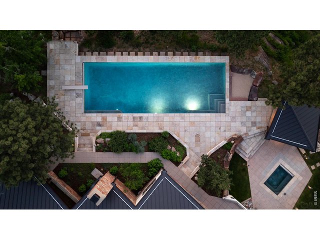 Property Photo 3 Oversized, heated, salt-water pool and hot tub.