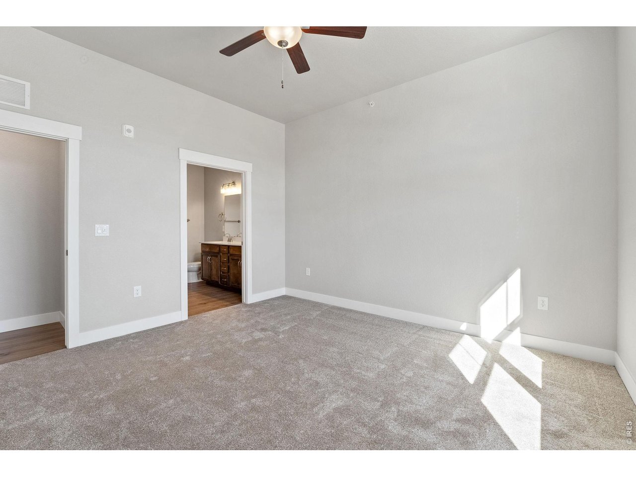 Property Photo 9 Primary bedroom with ceiling fan