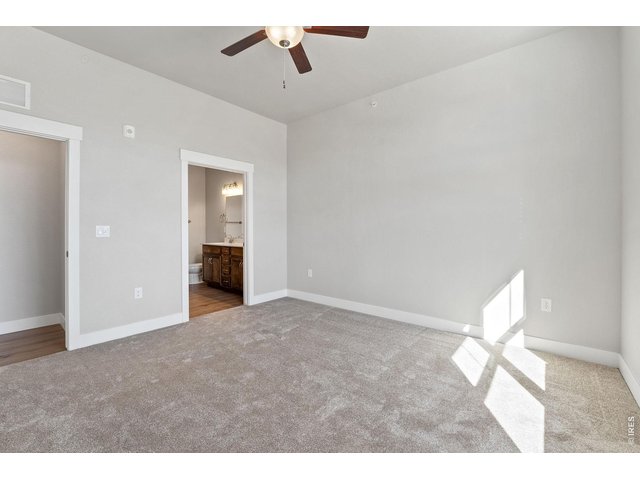 Property Photo 9 Primary bedroom with ceiling fan