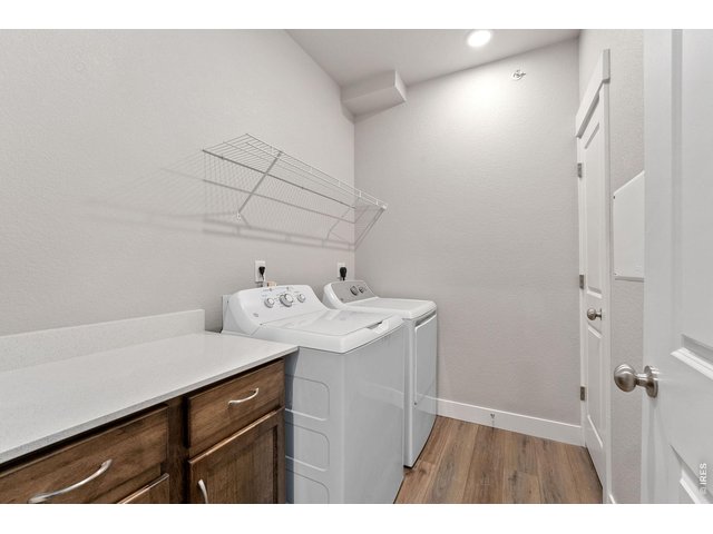 Property Photo 14 Laundry room w/ built in cabinets & shelving