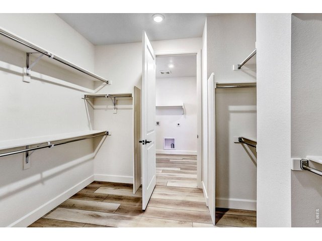 Property Photo 20 Primary Bedroom Closet with direct entry to Laudry