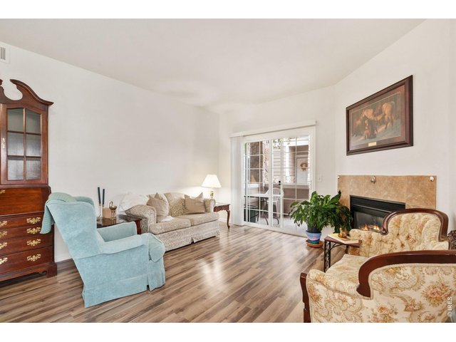 Property Photo 4 Bright and open. The living room has great light and cozy vibes.