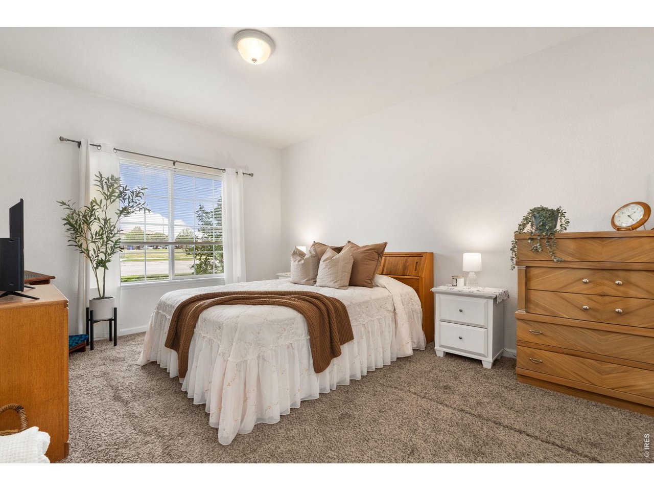 Primary bedroom retreat that is comfortable and filled with natural light
