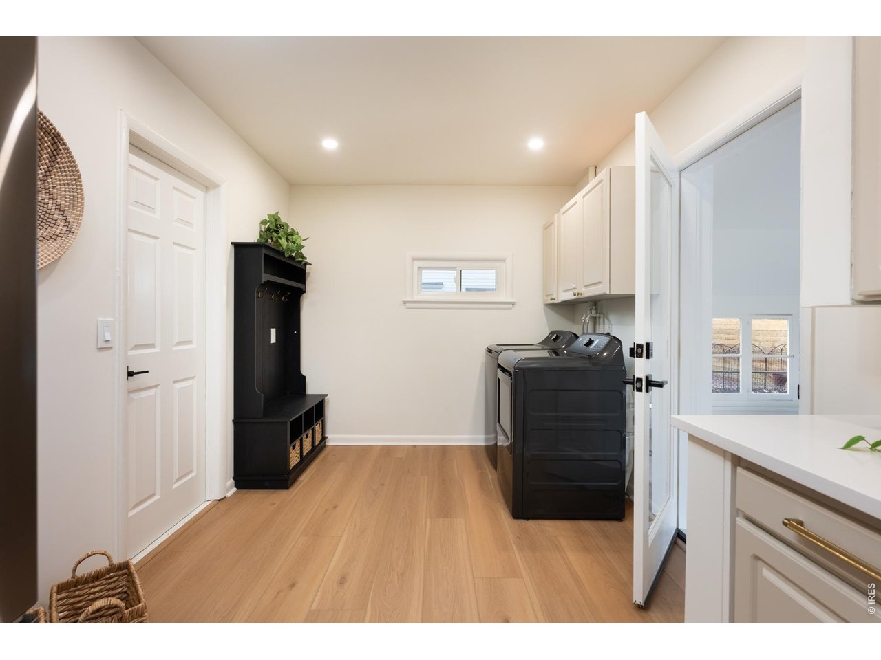 Mudroom/laundry room leads to sun-filled living room and second wood fireplace. 