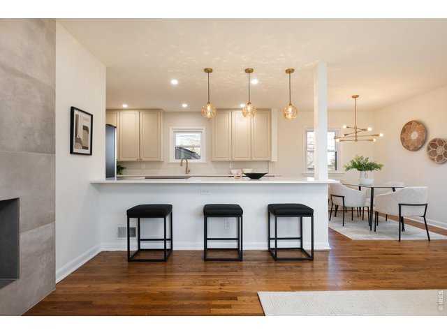 Property Photo 1 Completely updated kitchen and dining room with designer pendant lighting, 