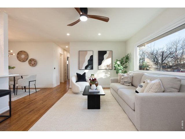 Property Photo 6 Organic modern aesthetic with sunlit living room. 