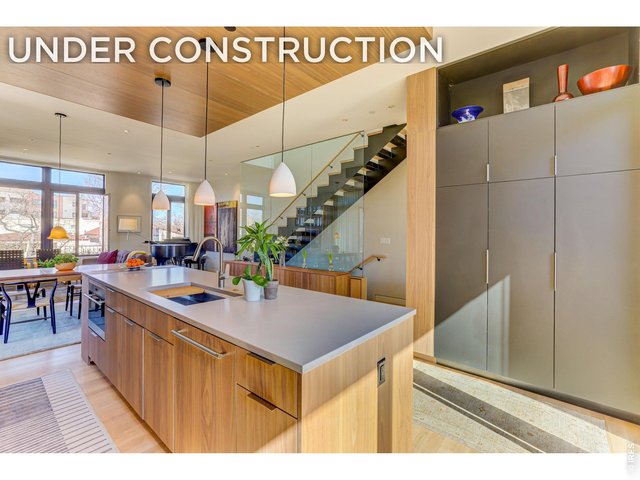 Property Photo 1 Another angle in the kitchen Concept Main Living Level! *Similar floor plan, finishes and feel at L'Avenir! (Picture is not of the actual build) Quartz Countertops, Shinnoki cabinetry. 