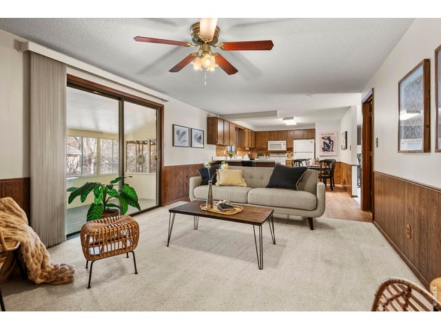 Property Photo 14 family room flows to enclosed sunroom