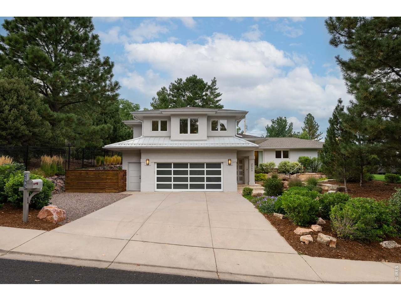 The attached, oversized 2-car garage features a newer door and epoxy flooring.
