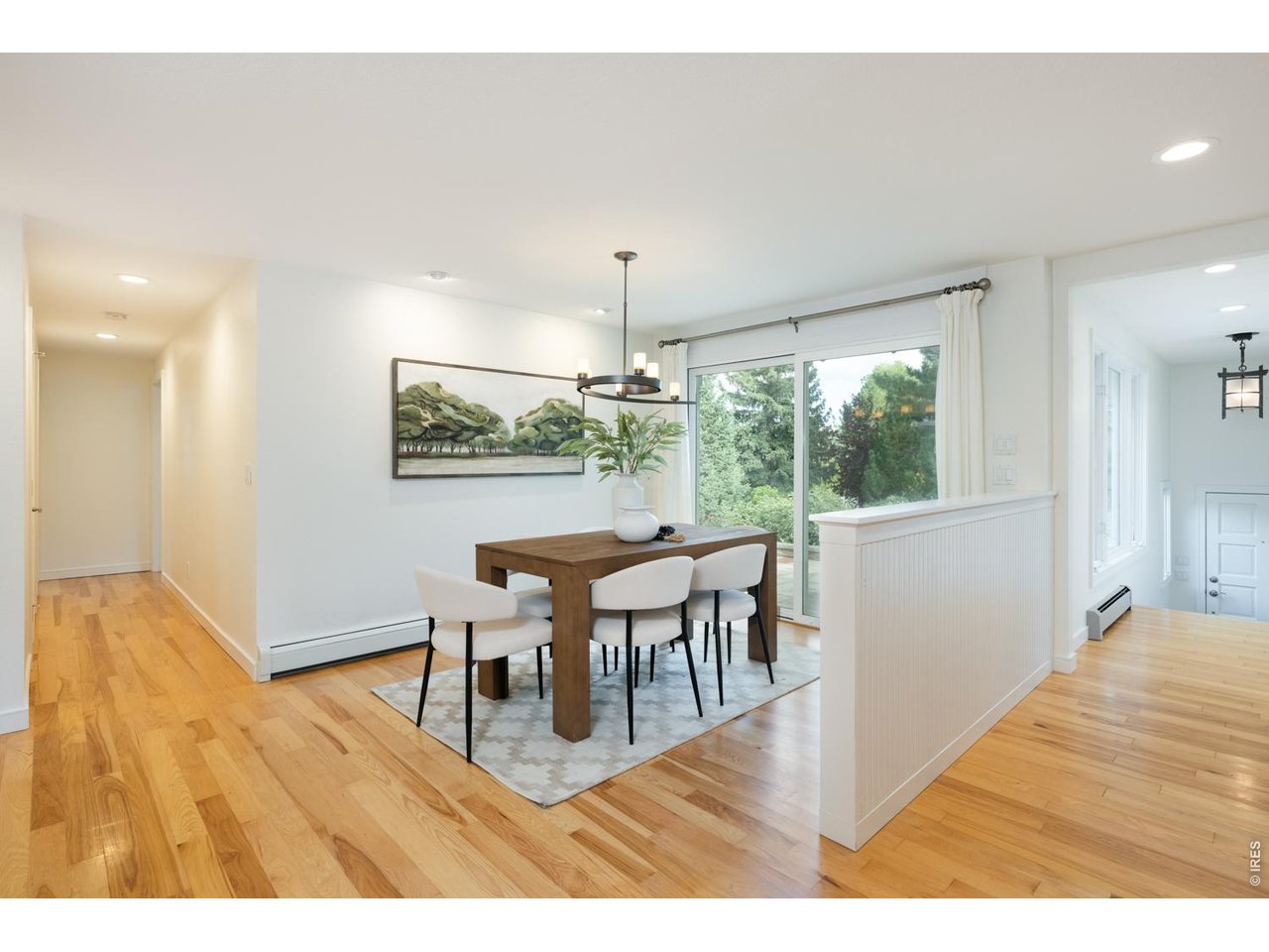 Hallway leads to closet, powder bath and two private guest bedrooms with ensuite baths. 