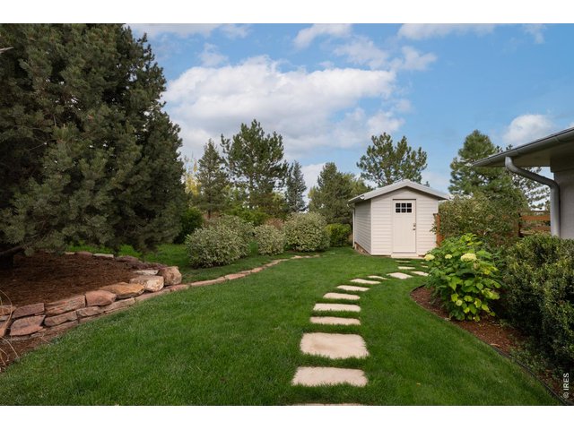 Property Photo 36 The spacious garden shed adds additional storage and organization. 