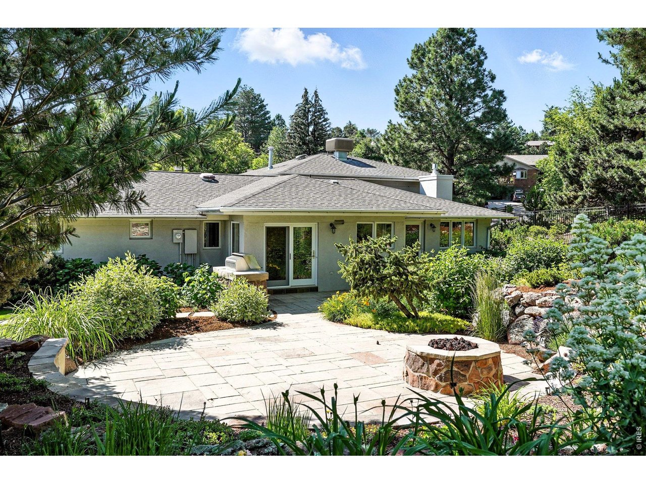 Beautifully landscaped patio and firepit.