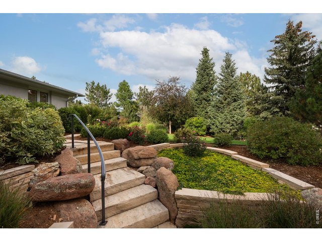 Property Photo 6 Terraced gardens and custom flagstone stairs lead to peaceful outdoor patio