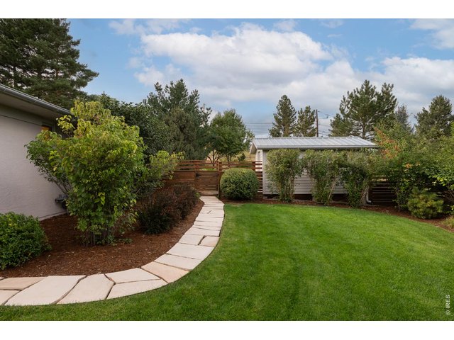 Property Photo 35 Flagstone footpath leads to private backyard oasis.