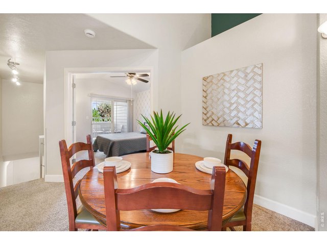 Property Photo 8 Seamless flow between the living, dining, and kitchen areas.