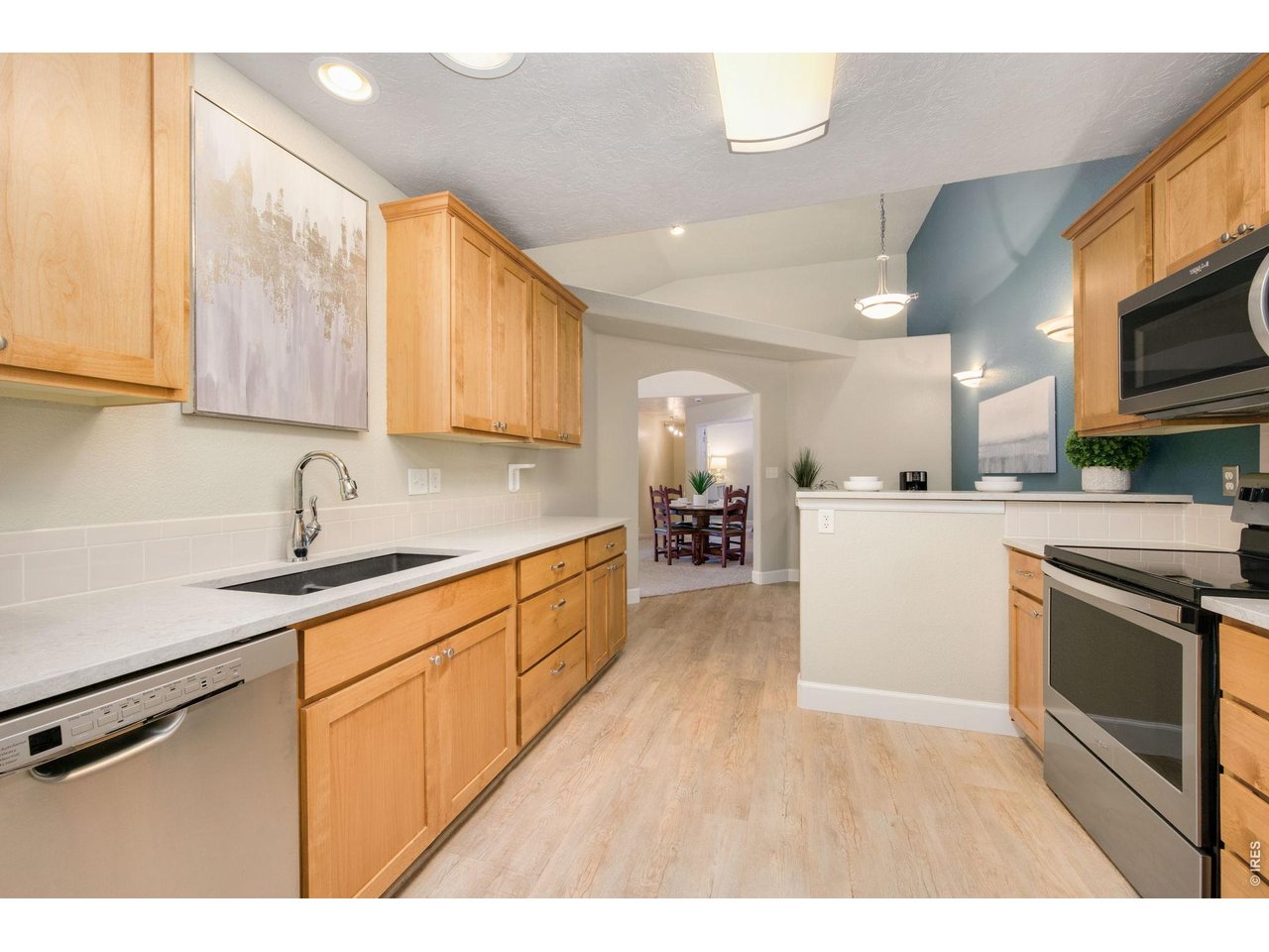 Kitchen featuring solid quartz countertops.