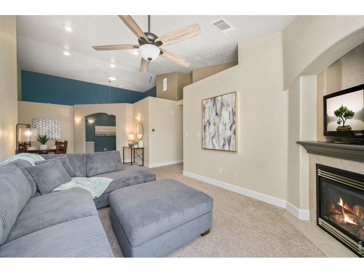 Open-concept living area newer, plush carper. 