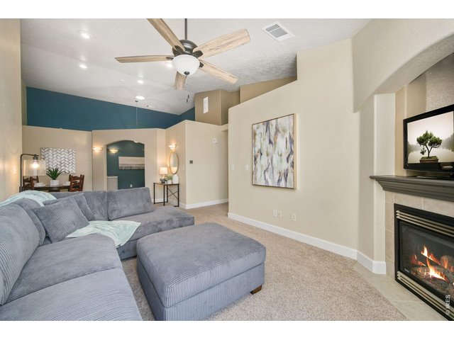 Property Photo 10 Open-concept living area newer, plush carper. 