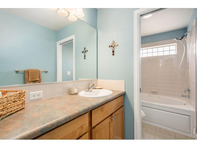 Property Photo 16 Generous second bathroom with large vanity and deep soaking tub. 