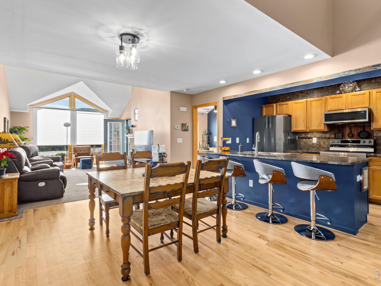 The open floor plan connects the kitchen, dining area, and living space-perfect for entertaining.