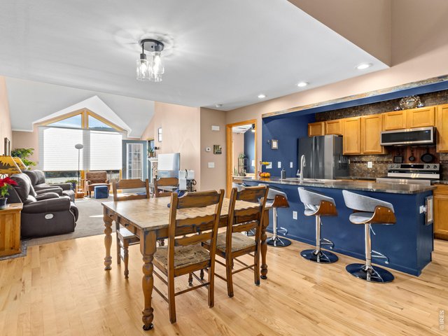 Property Photo 4 The open floor plan connects the kitchen, dining area, and living space-perfect for entertaining.