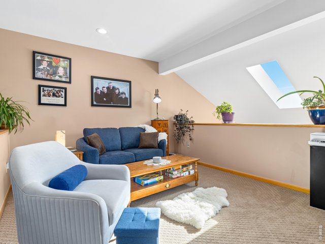 Property Photo 16 12x11 loft with skylight is ideal for a home office, reading nook, or extra living space.