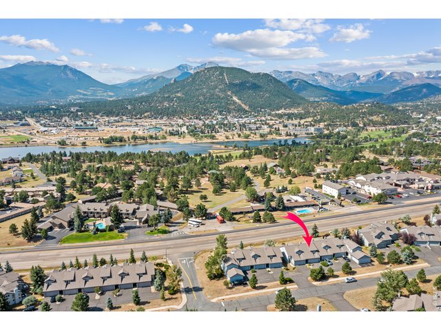 Property Photo 3 Located just minutes from downtown Estes Park and Rocky Mountain National Park, with the bike and walking path directly across the street offering miles of scenic routes around Lake Estes and throughout the valley.