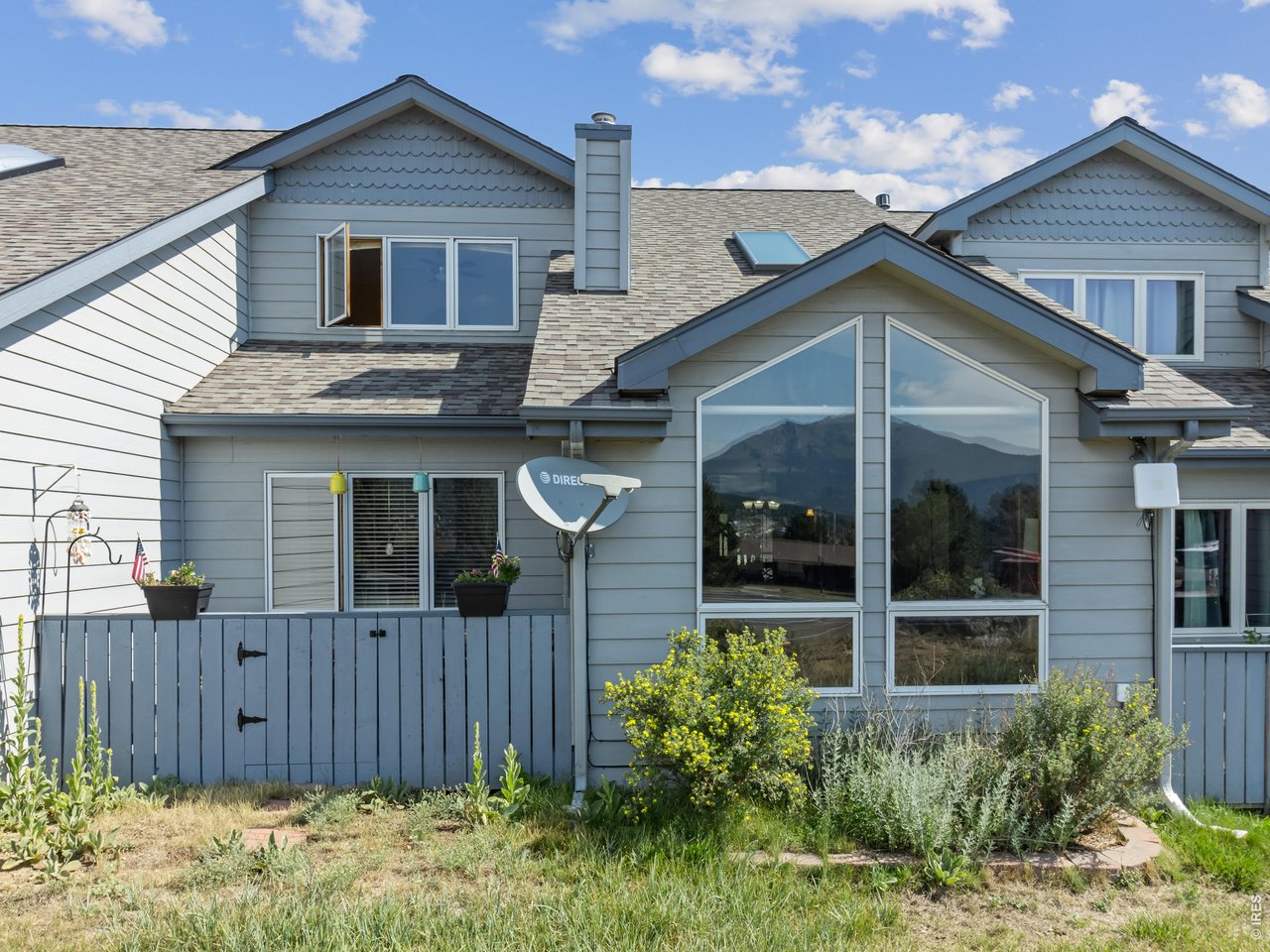 Dramatic floor-to-ceiling windows that frame breathtaking views of the tallest peaks in Rocky Mountain National Park.