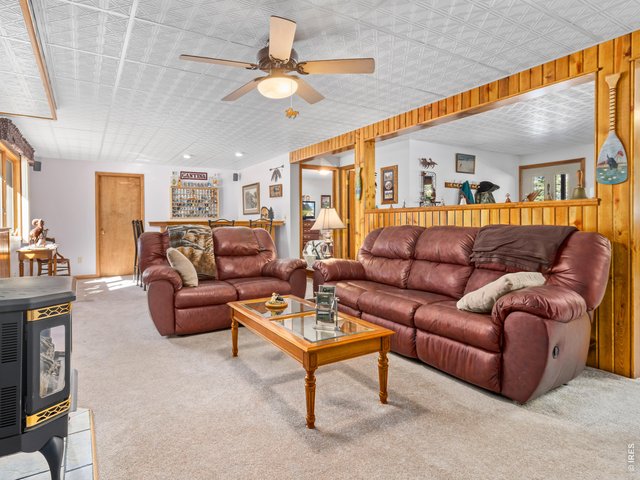 Property Photo 28 Lower level media room with woodstove