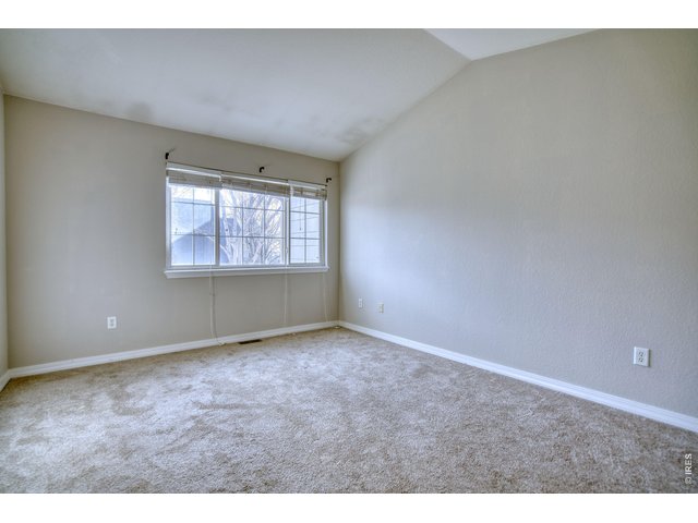 Property Photo 16 Primary bedroom with vaulted ceiling