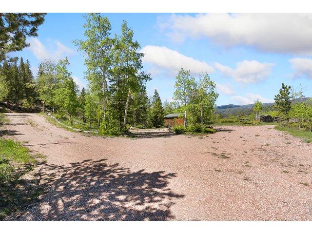 Property Photo 6 Gravel drive and parking area