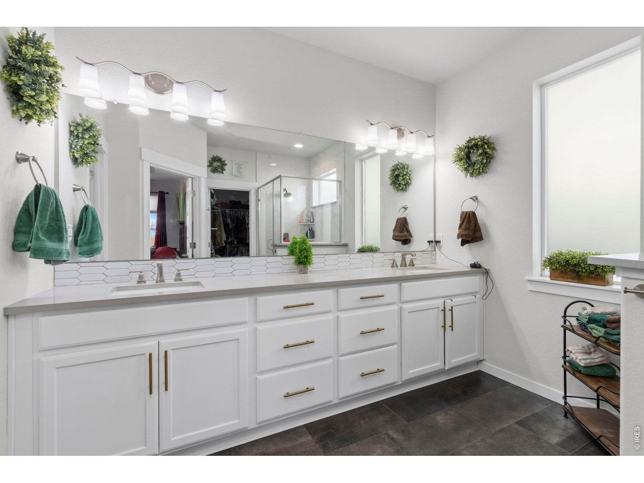 Stunning primary bathroom with opaque glass for just the right amount of natural light