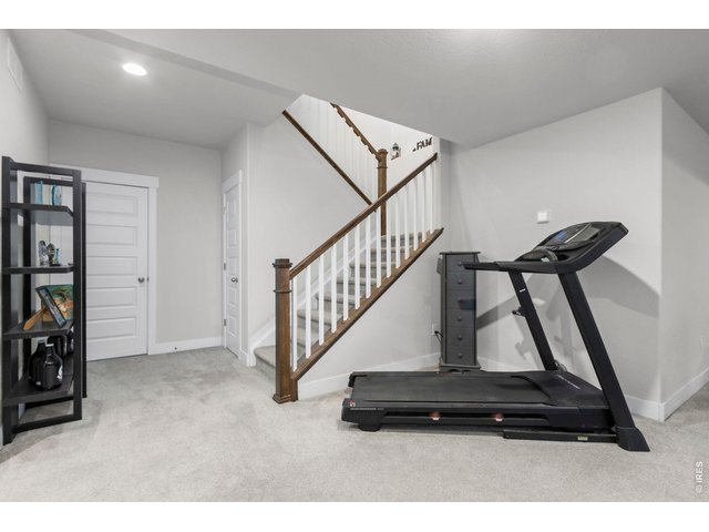 Property Photo 27 Wide staircase to the basement