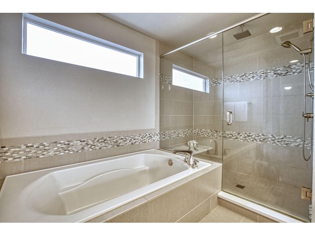 Property Photo 24 Primary Bathroom Tub and Shower