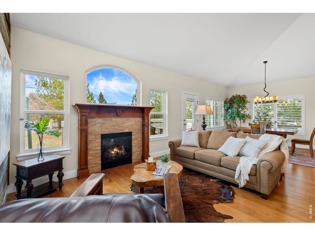 Property Photo 9 Living Room opens to Dining Room with plenty of room for entertaining and cozy gatherings.