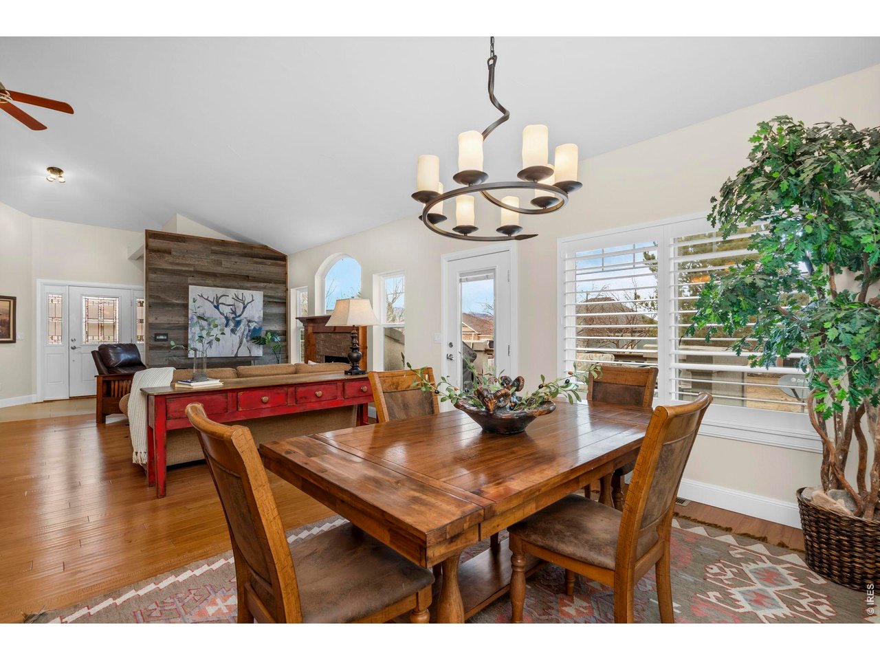 Vaulted ceilings, exquisite wood floors, and luxurious finishes create a warm and inviting ambiance.