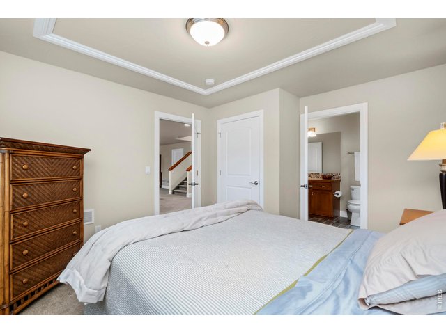 Property Photo 43 Bedroom 2 features an en suite full bathroom for added convenience and privacy.