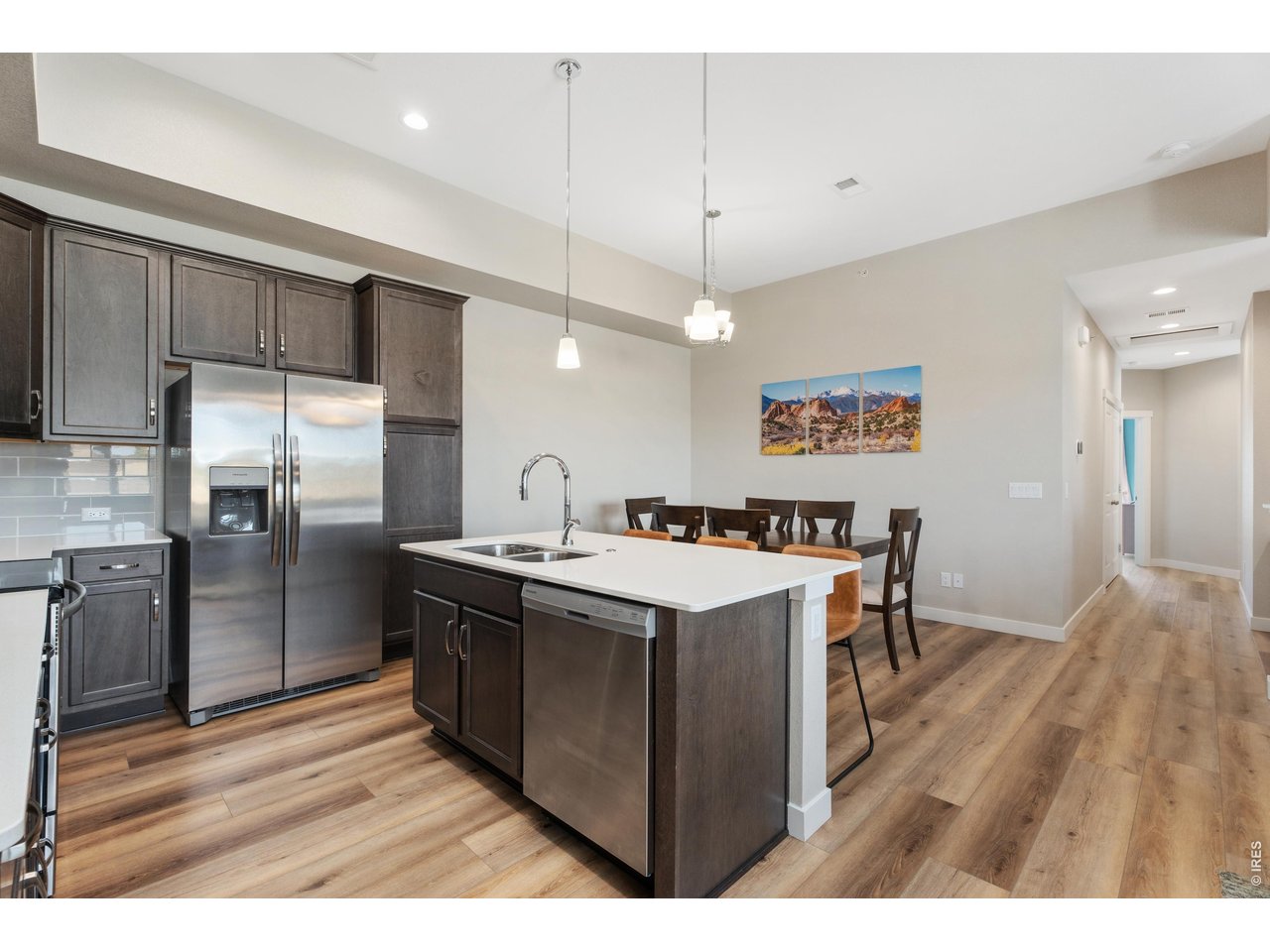 Very open floor plan, living room, kitchen, and dining.