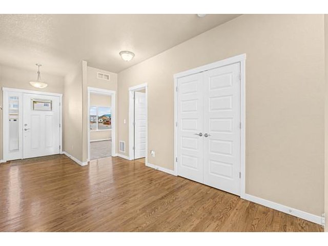 Property Photo 4 Foyer with wood flooring