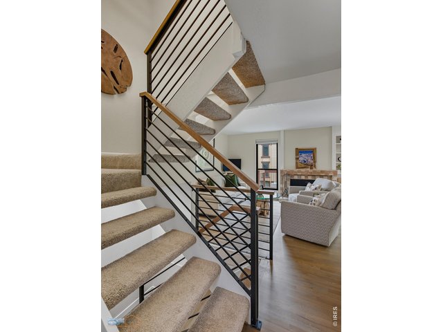 Property Photo 2 Bright & welcoming entry with new custom railings.