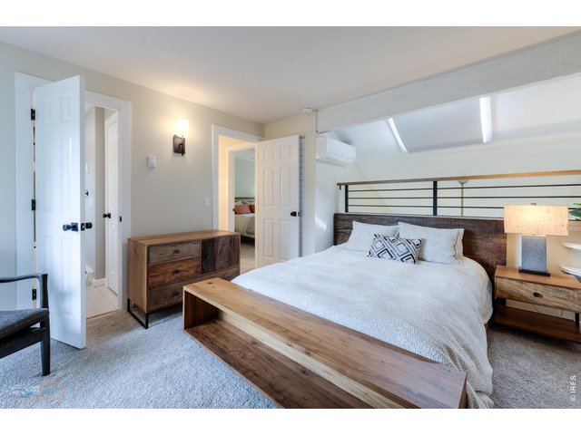 Property Photo 15 Primary bedroom with ensuite full bath + new split unit to cool bedroom and downstairs.