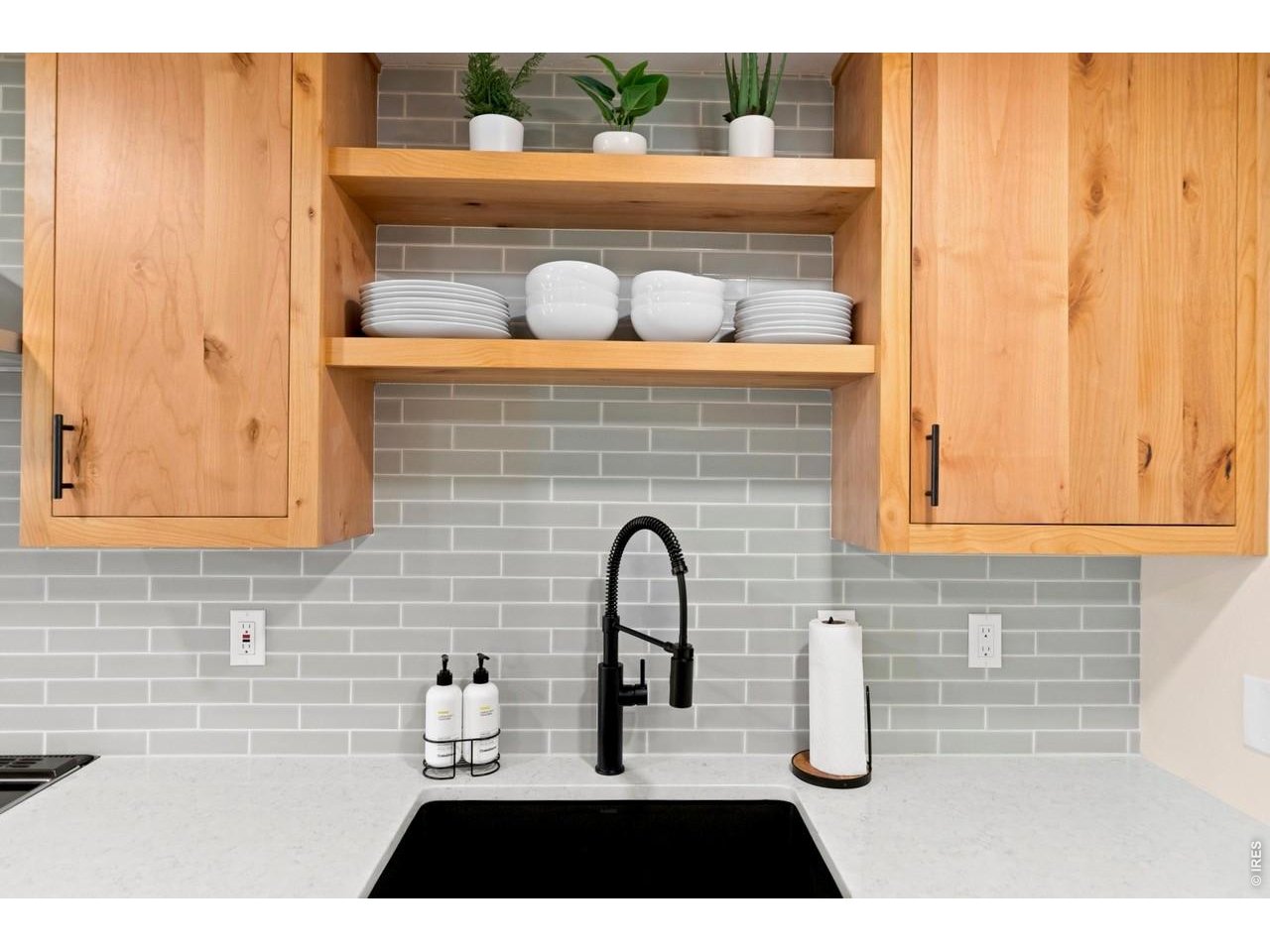 Beautiful Fireclay Tile backsplash & Bianco Silgranit sink.