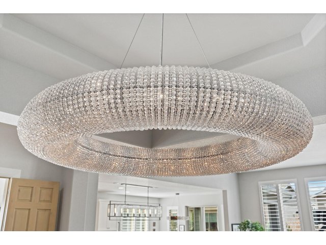 Property Photo 21 The crystal chandelier is a work of art and quite the statement! 