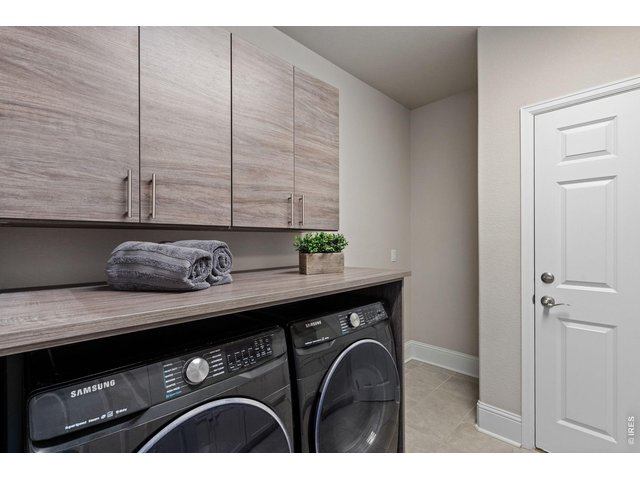 Property Photo 35 plenty of storage and thoughtful design make the laundry room sleek and efficient