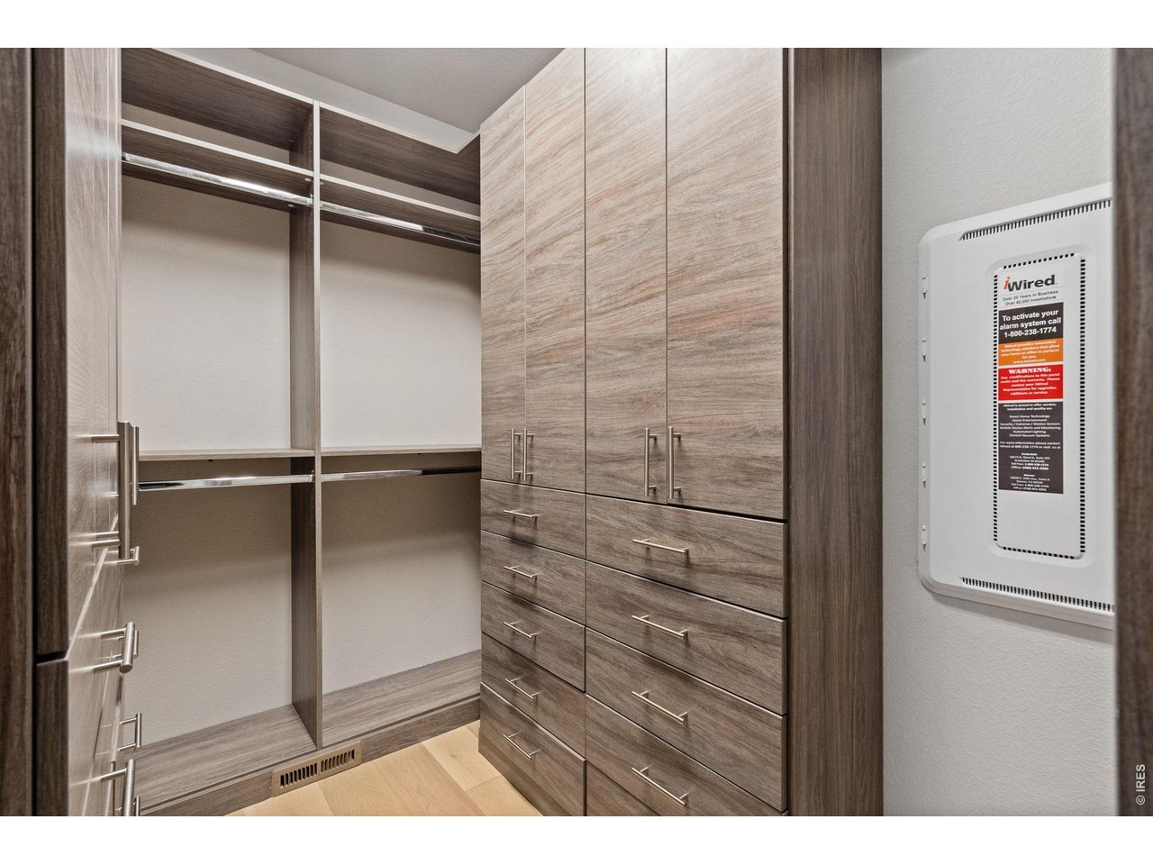 Customized walk-in closet offers pleanty of organization and storage