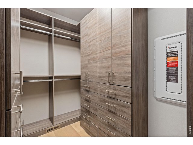 Property Photo 31 Customized walk-in closet offers pleanty of organization and storage