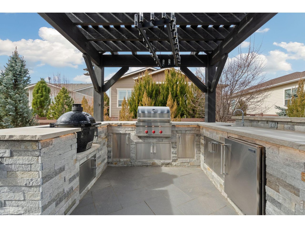 Built-in outdoor kitchen and BBQ Mature landscaping and enclosed yard for privacy 
