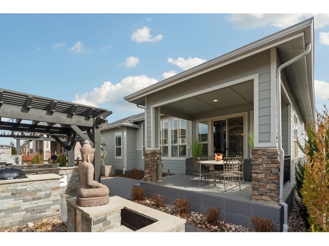Property Photo 6 Step into a backyard designed as an extension of the home's elegance. A tiered patio creates intimate gathering spaces