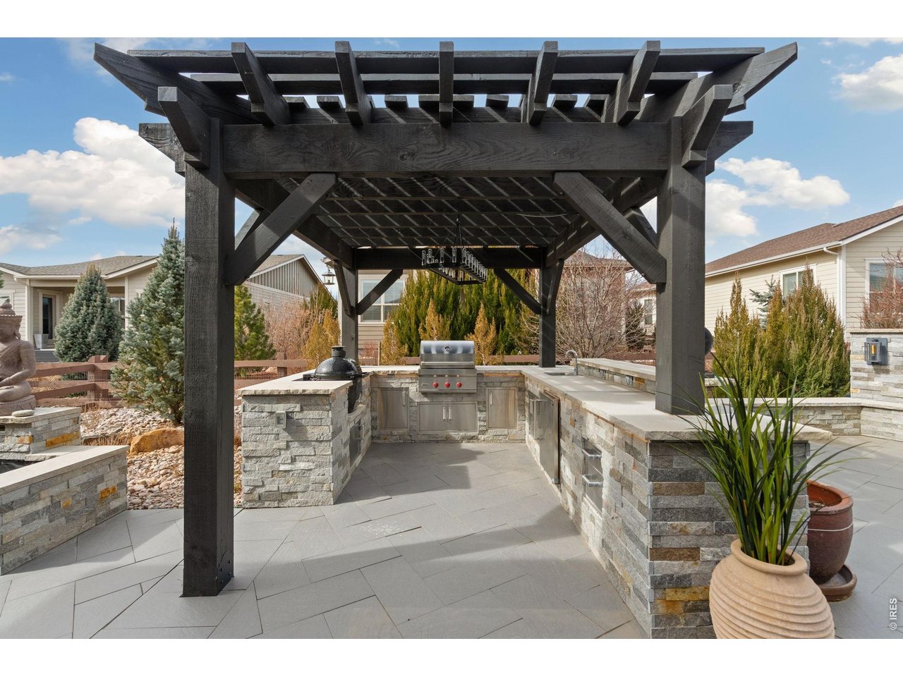 a fully appointed outdoor kitchen with built-in Wolf BBQ invites year-round gatherings under Colorado's expansive sky